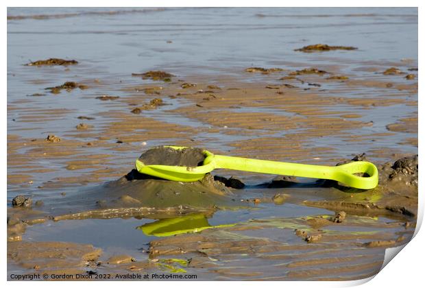 Abandoned yellow spade on Weymouth beach Print by Gordon Dixon