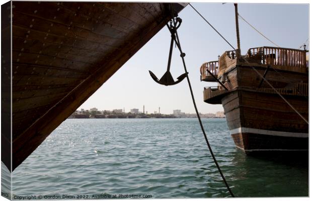 Cargo dhow bows and anchor, moored in Dubai creek UAE Canvas Print by Gordon Dixon