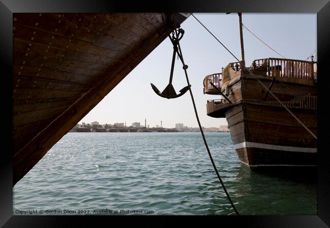 Cargo dhow bows and anchor, moored in Dubai creek UAE Framed Print by Gordon Dixon