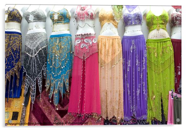 Belly dancer's dresses for sale in the cloth souk, Bur Dubai, UAE Acrylic by Gordon Dixon