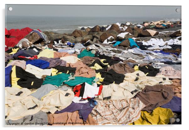 Freshly laundered clothes and fabrics drying on rocks by the sea at Mumbai, India Acrylic by Gordon Dixon