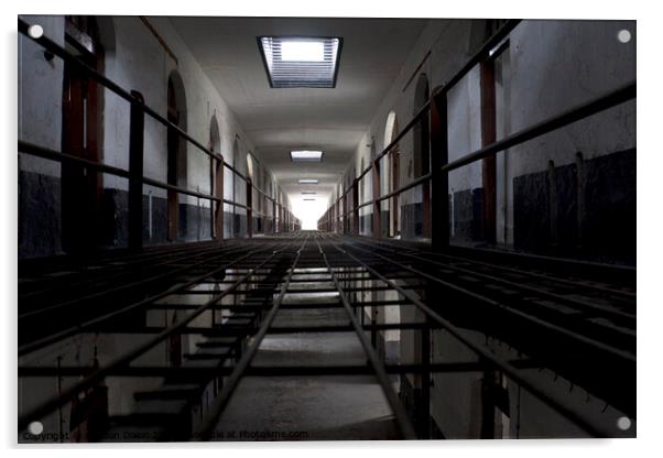 Light at the end of a corridor of cells in an abandoned prison in Kuala Lumpur Acrylic by Gordon Dixon