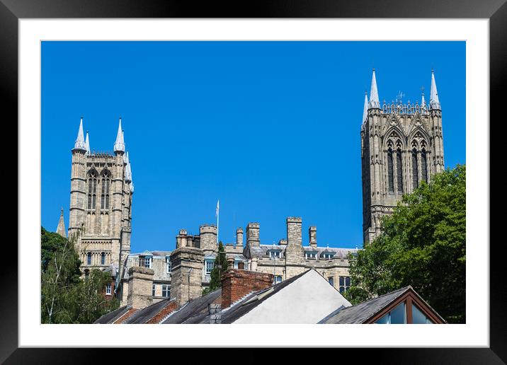 Lincoln cathedral peaks above the city skyline Framed Mounted Print by Jason Wells