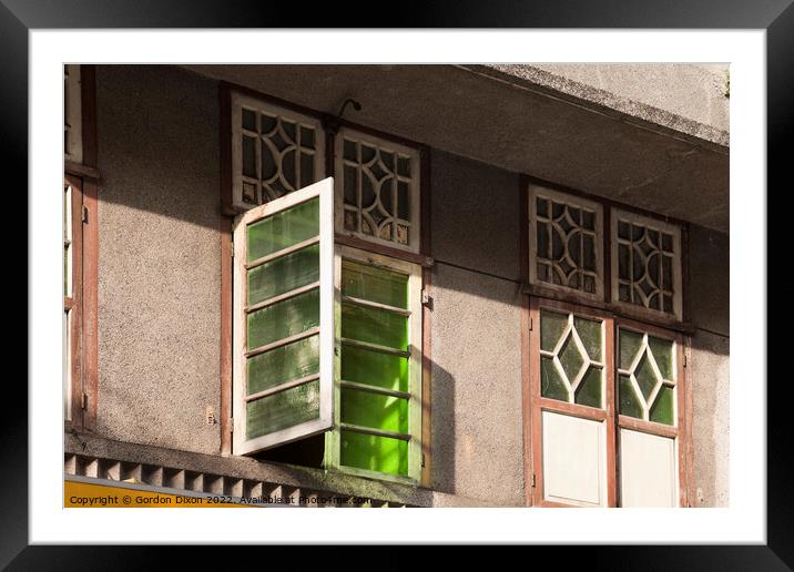 Old green glass windows on an old 'colonial' house in Mumbai, India Framed Mounted Print by Gordon Dixon