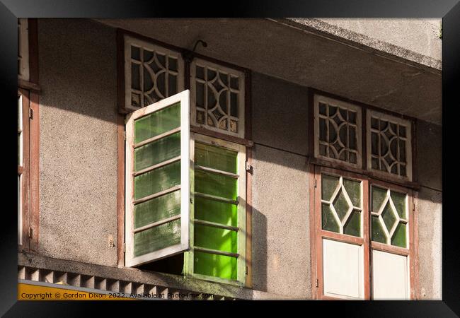 Old green glass windows on an old 'colonial' house in Mumbai, India Framed Print by Gordon Dixon