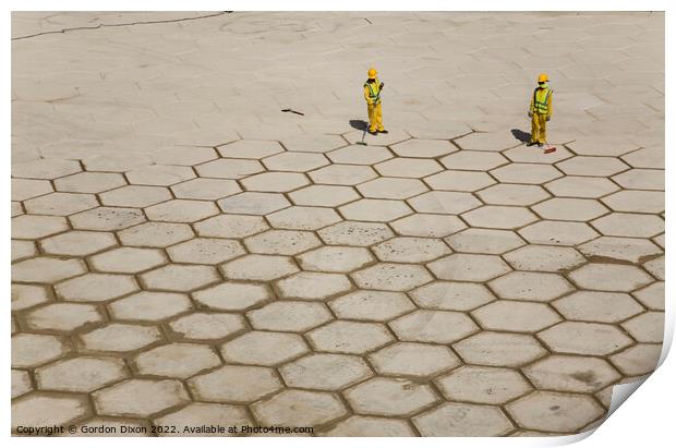 Pushing hexagons ? - workers in Dubai grout large tiles in Dubai Print by Gordon Dixon