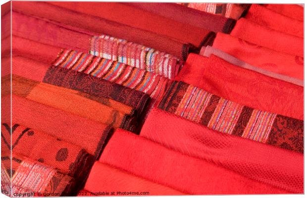 Selection of Red hand-made scarfs for sale Canvas Print by Gordon Dixon