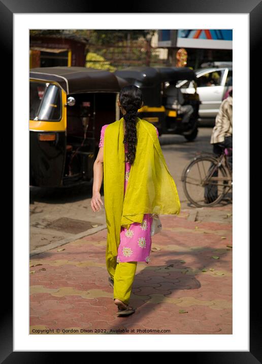 Traditionally dressed Indian lady walking along a street in Mumbai, India  Framed Mounted Print by Gordon Dixon