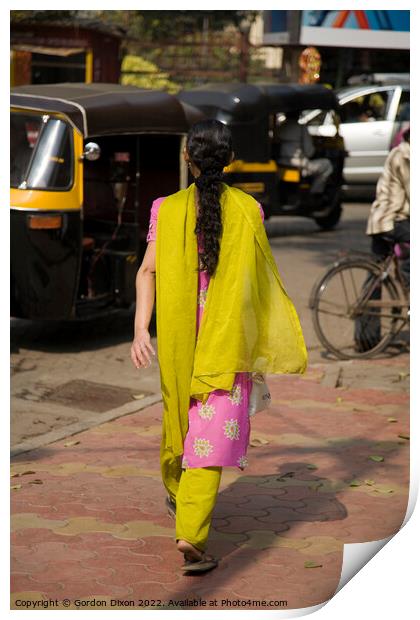 Traditionally dressed Indian lady walking along a street in Mumbai, India  Print by Gordon Dixon