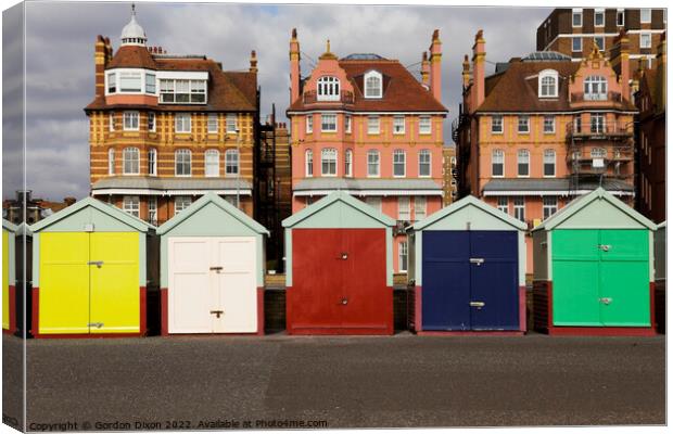 Five coloured beach huts on the Brighton seafront Canvas Print by Gordon Dixon