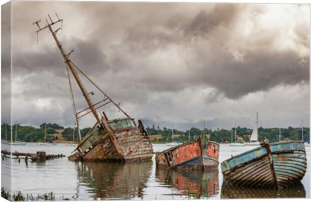 The Haunting Beauty of Pin Mill Boat Graveyard Canvas Print by Kevin Snelling