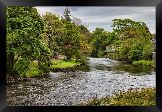 Serene Flowing River at Keswick Framed Print by Martin Day