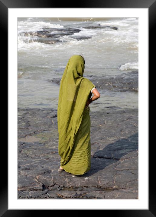 Indian lady dressed in green stands on a rock looking at the ocean - Mumbai  Framed Mounted Print by Gordon Dixon