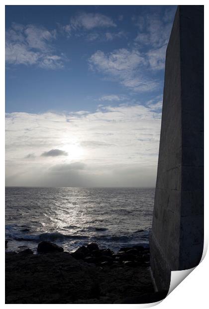 A dark obelisk looks over the sea at Portland Bill Dorset towards the setting sun Print by Gordon Dixon