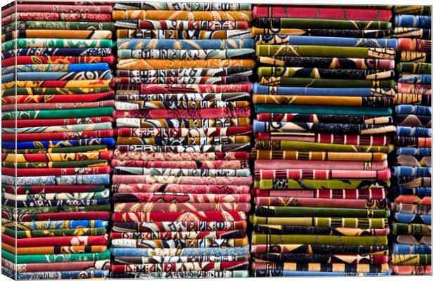 Stacks of colourful Prayer Mats for sale at an Istanbul market Canvas Print by Gordon Dixon