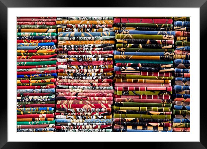 Stacks of colourful Prayer Mats for sale at an Istanbul market Framed Mounted Print by Gordon Dixon