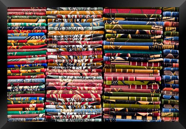 Stacks of colourful Prayer Mats for sale at an Istanbul market Framed Print by Gordon Dixon