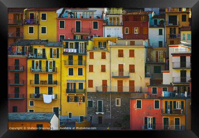 Manarola village, colorful pattern of houses. Cinque Terre Framed Print by Stefano Orazzini