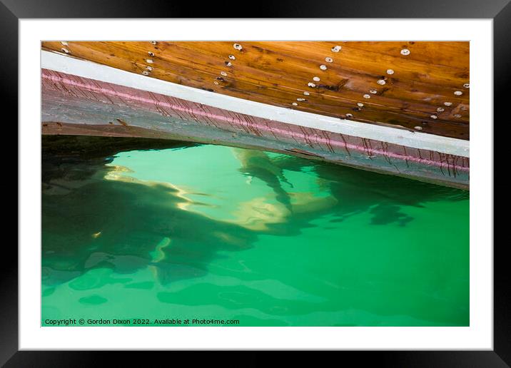 Submerged propeller of a cargo dhow in Dubai creek Framed Mounted Print by Gordon Dixon