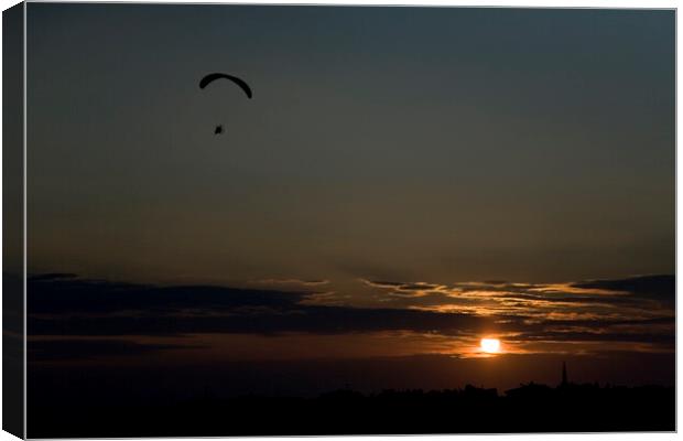 Powered paraglider pilot soars over the skyline of Istanbul at sunset Canvas Print by Gordon Dixon