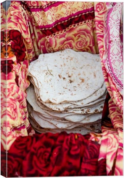 Turkish flatbreads for sale on a street market in Istanbul Canvas Print by Gordon Dixon