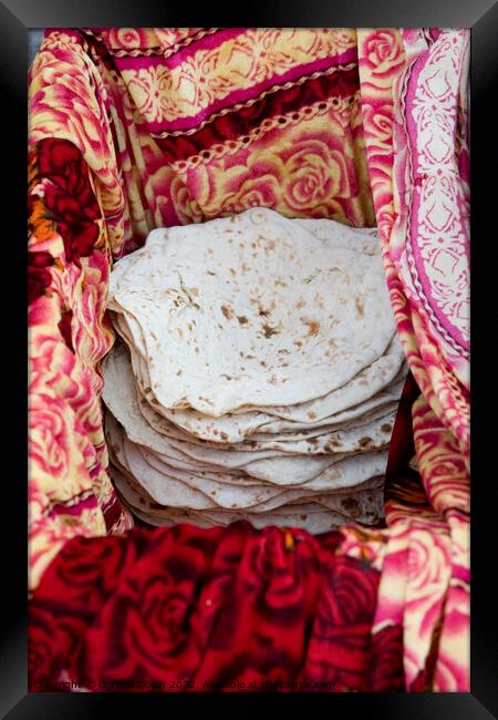 Turkish flatbreads for sale on a street market in Istanbul Framed Print by Gordon Dixon
