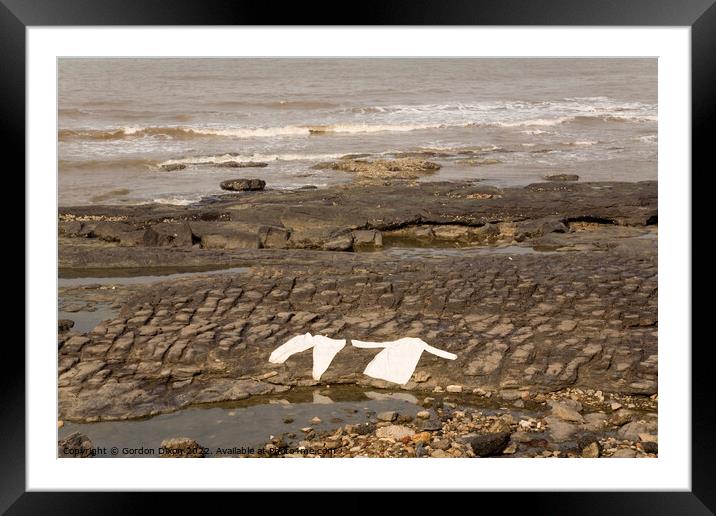 Lying flat out by the sea - laundry drying on rocks at Mumbai, India Framed Mounted Print by Gordon Dixon