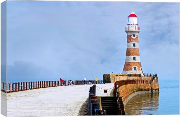 Fishing at Roker Pier and lighthouse, Sunderland Canvas Print by Martyn Arnold