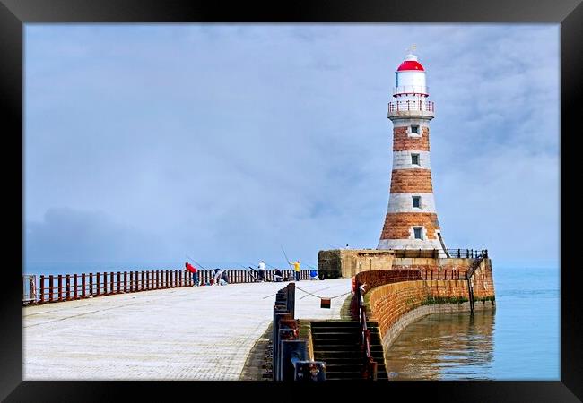 Fishing at Roker Pier and lighthouse, Sunderland Framed Print by Martyn Arnold