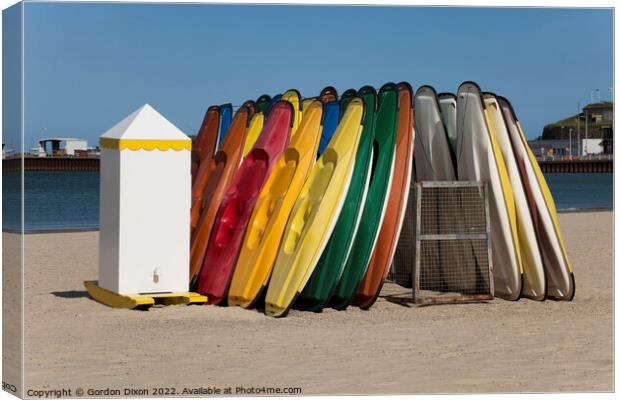 Colourful sit-on kayaks for hire on Weymouth beach Canvas Print by Gordon Dixon