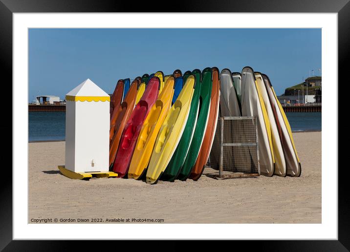 Colourful sit-on kayaks for hire on Weymouth beach Framed Mounted Print by Gordon Dixon