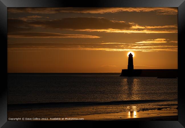 Sunrise behind the light tower at the entrance of Berwick upon tweed harbour Framed Print by Dave Collins