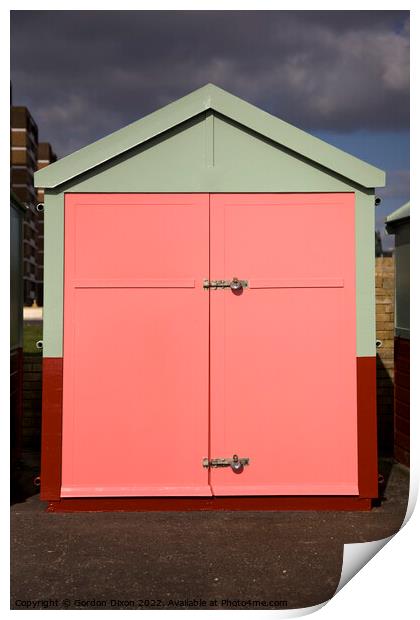 Peach colour beach hut against stormy sky Print by Gordon Dixon