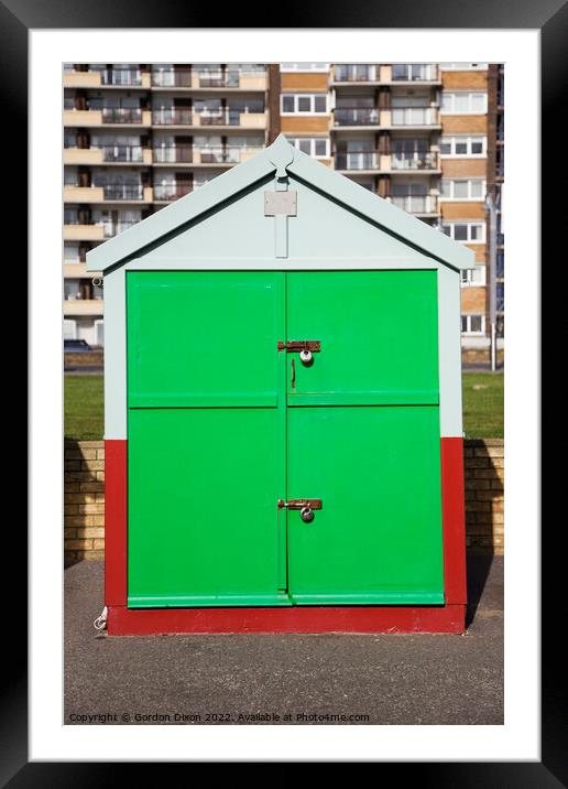 Bright green painted door of a sea front beach hut, Brighton and Hove Framed Mounted Print by Gordon Dixon