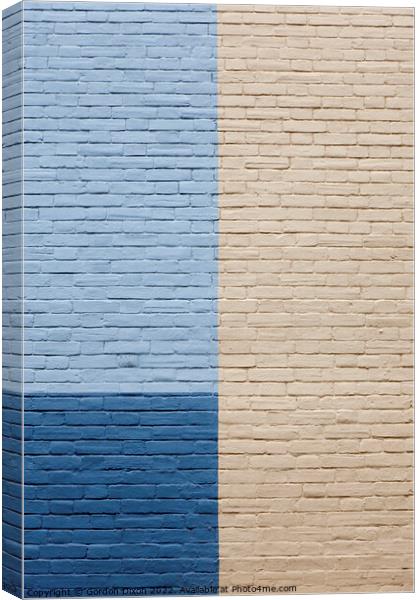 Blues and cream painted brick wall Canvas Print by Gordon Dixon