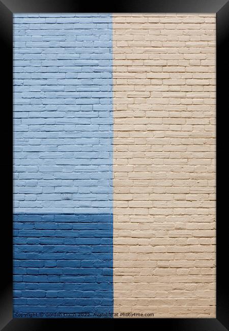 Blues and cream painted brick wall Framed Print by Gordon Dixon