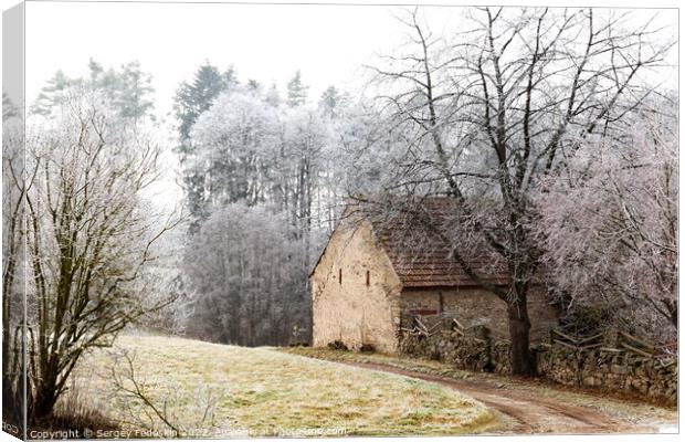 Winter landscape with old house in Czechia. Canvas Print by Sergey Fedoskin