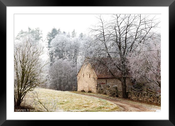 Winter landscape with old house in Czechia. Framed Mounted Print by Sergey Fedoskin