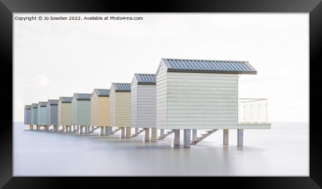 Receding beach huts, Osea  Framed Print by Jo Sowden