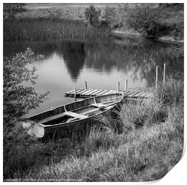 Traditional rowing boat mooring Print by Chris Rose