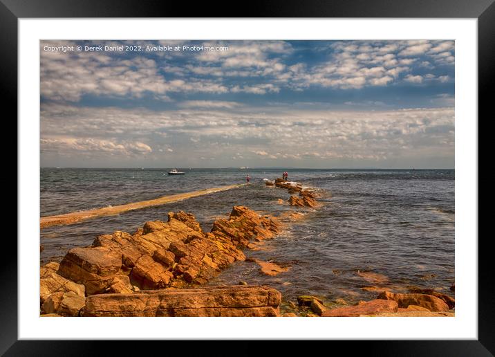 Fishing on the rocks at Peveril Point, Swanage Framed Mounted Print by Derek Daniel