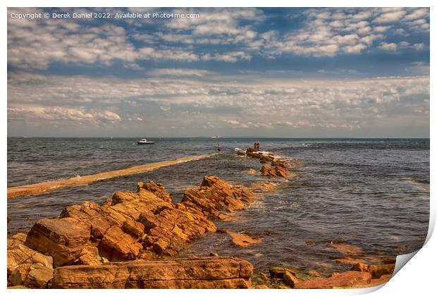 Fishing on the rocks at Peveril Point, Swanage Print by Derek Daniel