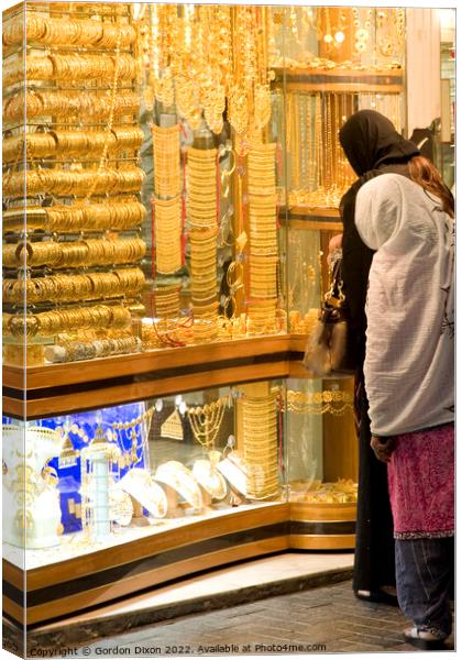 2 ladies shop for gold in the Dubai gold souk Canvas Print by Gordon Dixon