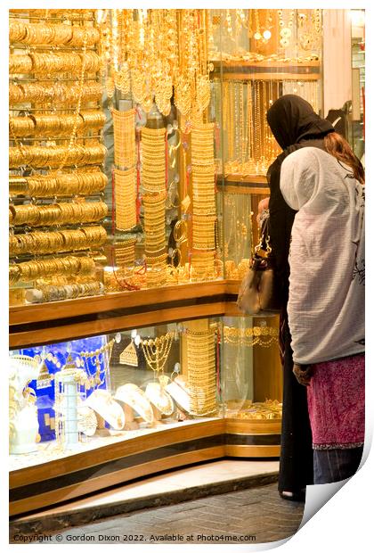 2 ladies shop for gold in the Dubai gold souk Print by Gordon Dixon
