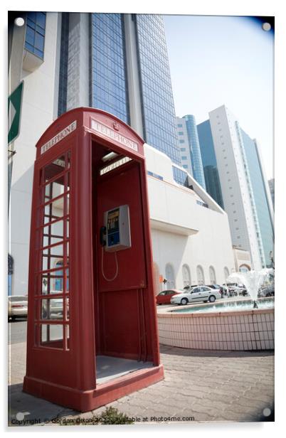 An old British telephone box stood on the pavement in Dubai  Acrylic by Gordon Dixon