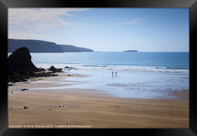 Walking the beach at Broadhaven Pembrokeshire Framed Print by Chris Warren