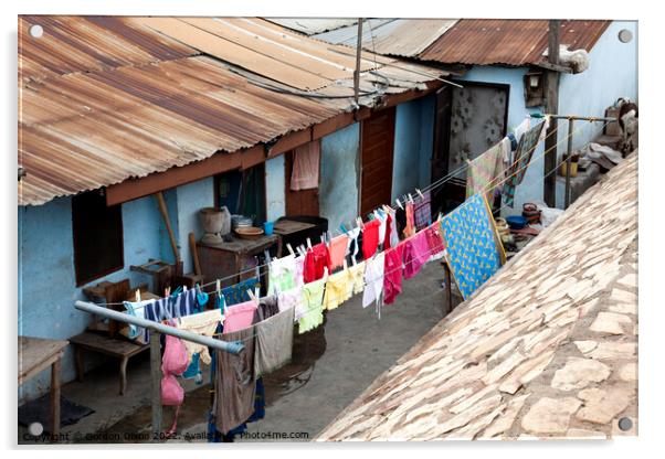 Bright colours in the laundry drying at a shanty town in Accra, Ghana Acrylic by Gordon Dixon