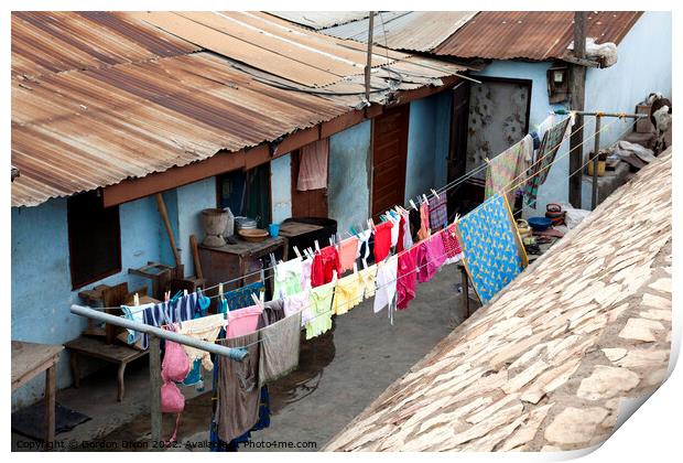 Bright colours in the laundry drying at a shanty town in Accra, Ghana Print by Gordon Dixon