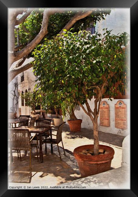 A Shaded Table in Mojácar Framed Print by Ian Lewis