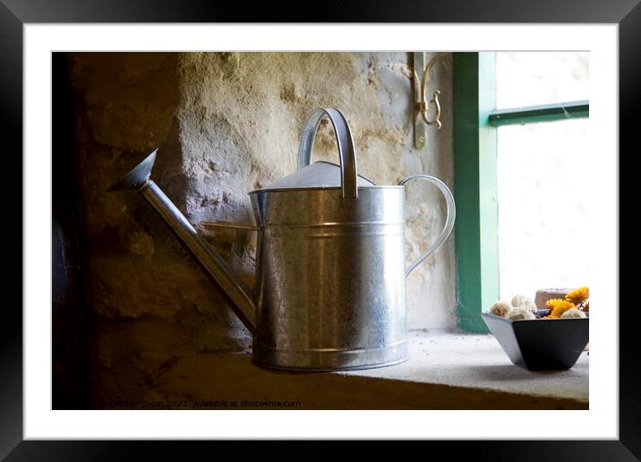 A galvanised watering can sits on a windowsill Framed Mounted Print by Gordon Dixon